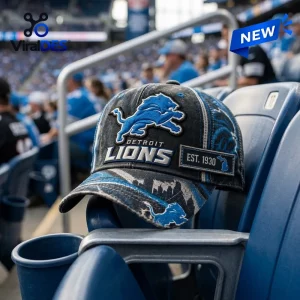 Front view of a Detroit Lions NFL Distressed Baseball Cap resting on a stadium seat.