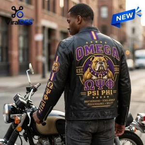 Rear view of man wearing an Omega Psi Phi 1911 mascot leather jacket next to a motorcycle.