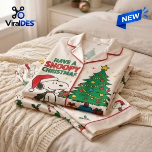 Folded Snoopy Christmas Satin Pajamas Set featuring a holiday tree and text graphic.