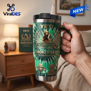 Smokey Bear 82nd Anniversary Green Stanley Tumbler featuring the forest service mascot, wildfire prevention text, and logo.