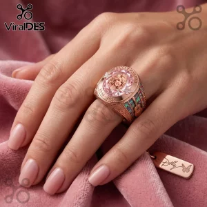 Dolly Parton 1946-2026 Rose Gold Ring features a portrait, butterfly accents, and guitar inlays on a pink velvet backdrop.