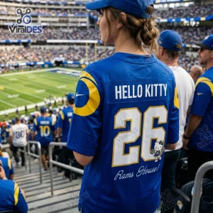 Back view of a fan wearing a blue Hello Kitty Los Angeles Rams football jersey with number 26 at a stadium.