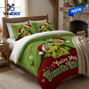 Front view of Grinch Christmas couple bedding set with green faux fur and personalized hats.