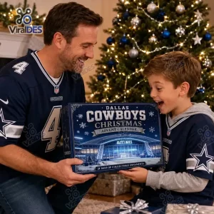 Father and son holding a Dallas Cowboys Christmas Advent Calendar near a lit tree.