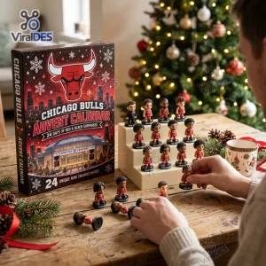 Person setting up Chicago Bulls Mini Figurine Advent Calendar 2026 on a festive wooden table.