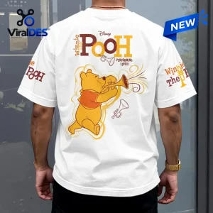 Back view of a Winnie the Pooh white shirt featuring a bear graphic playing a trumpet.