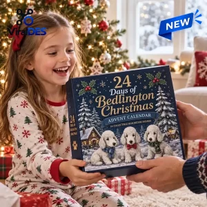 Young girl smiling while holding the Bedlington Terrier Christmas Advent Calendar 2026 near a tree.