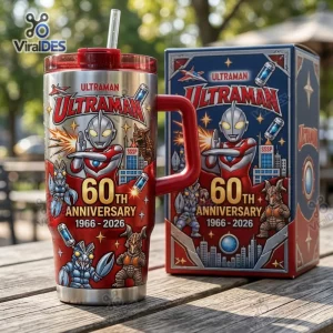 Front view of an Ultraman 60th Anniversary 1966-2026 Tumbler Cup with matching box on a wooden table.