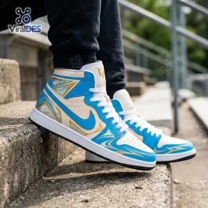 Side view of Lionel Messi Air Jordan 1 High Top Sneakers in blue, white, and gold worn on outdoor stairs.