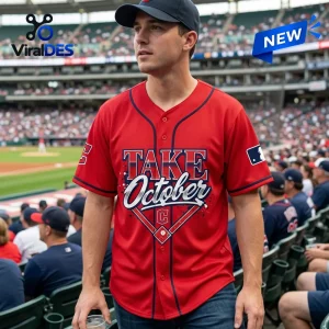 Man wearing a Cleveland Guardians 2026 Postseason Red Baseball Jersey at a stadium.