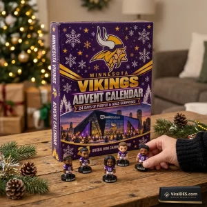 Front view of the Minnesota Vikings 2026 Advent Calendar box on a wooden table with mini figurines.