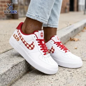 Side view of a Delta Sigma Theta Custom Air Force 1 Sneaker with red and white checkered swoosh and Greek letters.