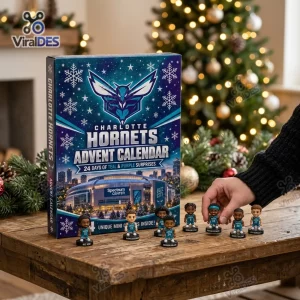 Front view of the Charlotte Hornets 2026 Advent Calendar box with mini figurines displayed on a wooden table.