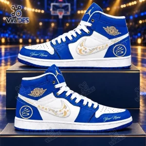 Side view of Stephen Curry Air Jordan 1 High Top Sneakers in royal blue and white with gold accents.