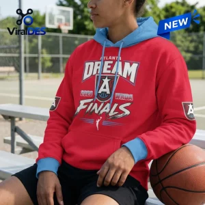 Person wearing an Atlanta Dream 2026 WNBA Finals Red Hoodie with blue hood and cuffs sitting outdoors.