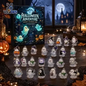 Front view of the Halloween 2026 Ghost Advent Calendar box next to acrylic charms arranged on a wooden table.