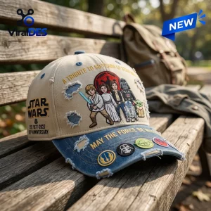 Front view of Star Wars 50th Anniversary Distressed Baseball Cap sitting on a wooden bench outdoors.