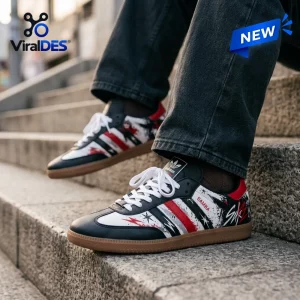 Side view of Stray Kids Black Red Samba Sneakers worn with dark jeans on outdoor stone steps.