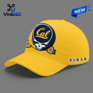 Front view of a yellow baseball cap with a blue skull emblem and yellow roses.