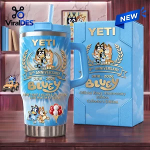 Front view of the Bluey 8th Anniversary Blue Stanley Tumbler 40oz with matching gift box on a wooden desk.