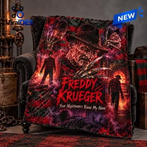 Front view of a Freddy Krueger Nightmare Fleece Blanket draped over a dark armchair with red horror graphic print.