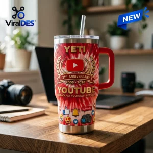Front view of YouTube 21st Anniversary Stanley Handle Tumbler on wooden desk.