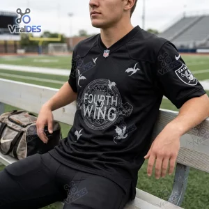 Front view of a person wearing a Las Vegas Raiders Fourth Wing Day Football Jersey sitting on a bench.