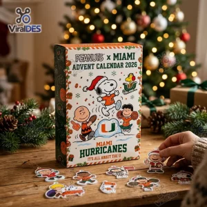 Front view of Peanuts x Miami Hurricanes 2026 Advent Calendar box with character cutouts on a wooden table.