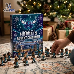 Front view of the Charlotte Hornets 2026 Advent Calendar surrounded by miniature figurines on a patterned rug.