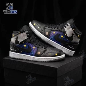 Side view of Coraline Black Cat Starry Night Air Jordan 1 Sneakers resting on a black box.