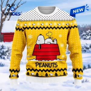 Front view of Peanuts Snoopy Yellow Christmas Ugly Sweater featuring Snoopy on his red doghouse.