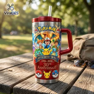 Front view of Pokemon Gotta Catch 'Em All 30th Anniversary Tumbler with characters on wooden table.