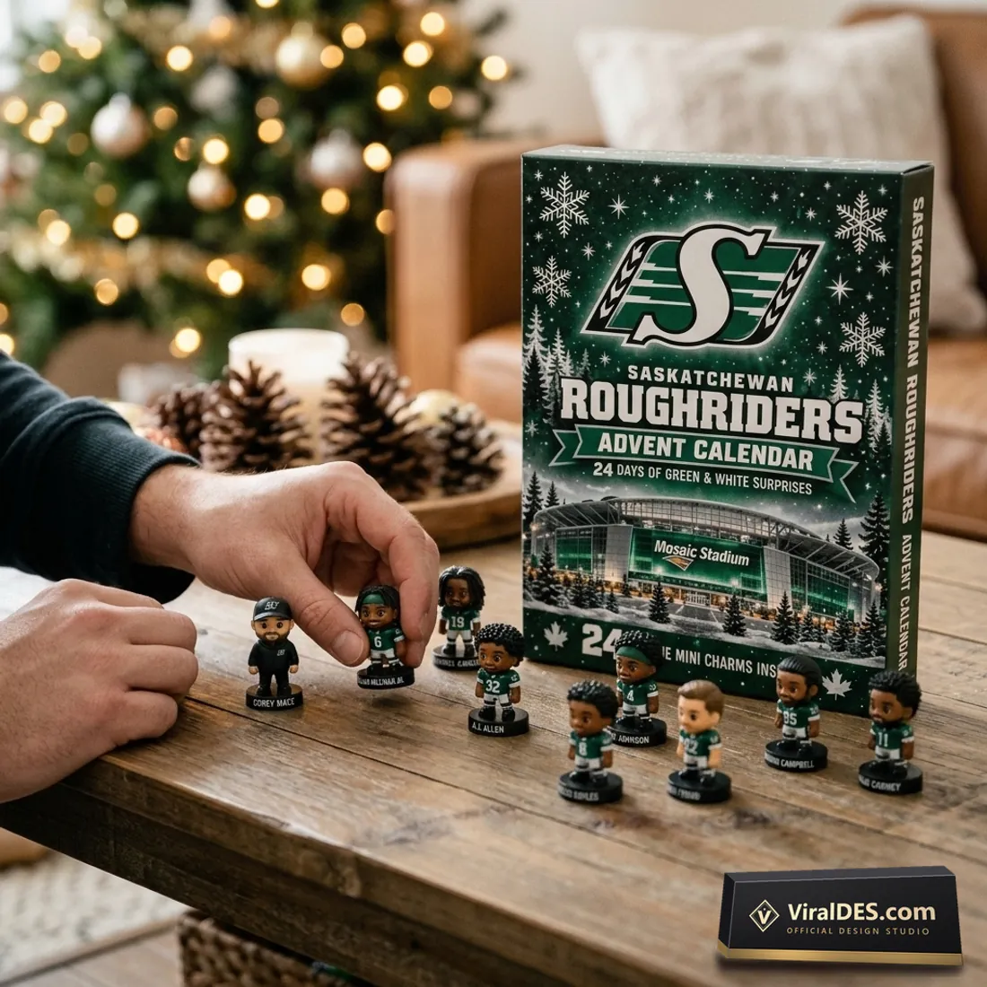 Collector arranging miniature Saskatchewan Roughriders figurines on a wooden table beside the 2026 Advent Calendar box