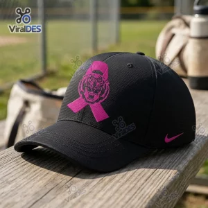 Front view of an LSU Tigers Breast Cancer Awareness baseball cap resting on a wooden bench.