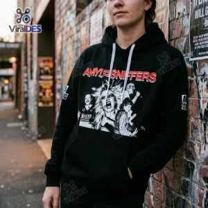 Front view of a person wearing a black Amyl and the Sniffers Australia Tour Hoodie with band graphic.