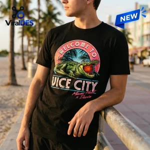 Front view of a person wearing a Grand Theft Auto VI x Miami Heat Shirt with an alligator graphic.
