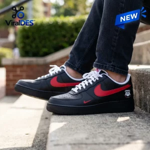 Side view of Georgia Bulldogs Black In Black Air Force 1 Sneaker worn on concrete steps.