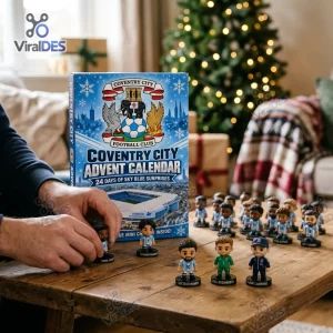 Front view of a Coventry City FC Advent Calendar box with miniature figurines on a wooden table.