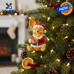 Close-up of Winnie The Pooh Christmas Advent Calendar 2026 ornament hanging on a lit tree.