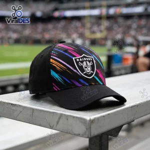 Front view of Las Vegas Raiders NFL Crucial Catch 2026 black cap resting on a metal bench.