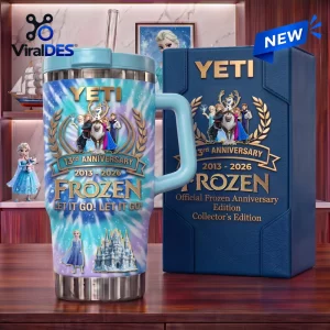 Front view of Frozen 13th Anniversary Stanley Tumbler with blue handle next to matching gift box.