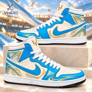 Side view of Lionel Messi Air Jordan 1 High Top Sneakers in blue, white, and gold with geometric heel patterns.