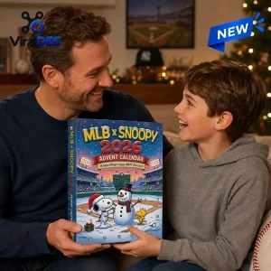 Father and son holding the MLB x Snoopy 2026 Advent Calendar in a festive living room setting.