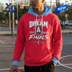 Front view of an Atlanta Dream 2026 WNBA Finals red hoodie with light blue hood lining and cuffs, worn on an outdoor court.