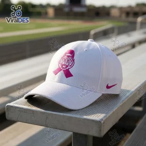 Front view of a white Louisiana State University Tigers Pink Ribbon Baseball Cap resting on a wooden bench.