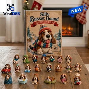 Front view of the Silly Basset Hound Advent Calendar 2026 box with twenty-four tiny dog figurines displayed on a wooden table.