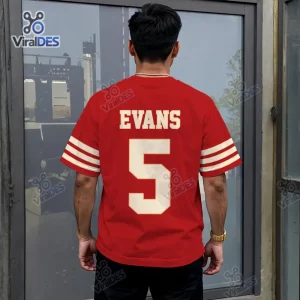 Back view of a person wearing a red San Francisco 49ers Mike Evans shirt with white number 5 and sleeve stripes.