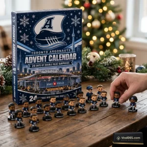 Toronto Argonauts 2026 Advent Calendar box next to small football player figurines on a wooden table.