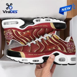 Side view of Brisbane Lions 2026 AFL Premiers Air Max Plus sneakers inside a shoebox.