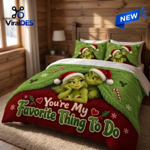 Front view of Grinch Christmas couple bedding set with green and red holiday text.